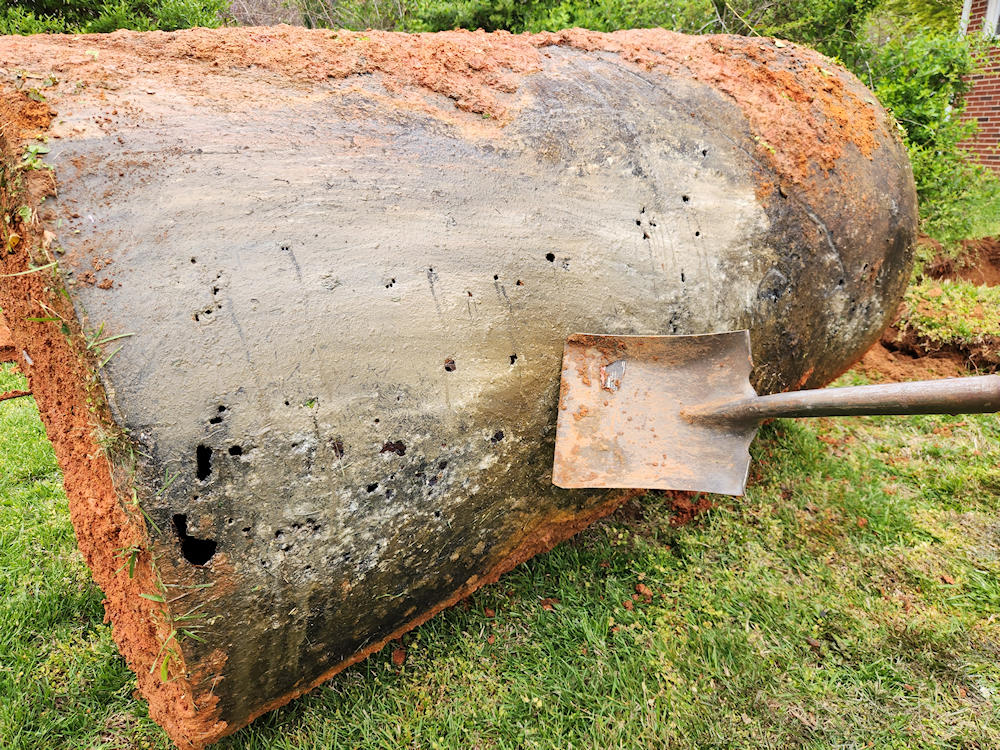 View of corrosion holes in underground oil tank after removal.